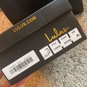 Short open toed heels with ankle strap. Never worn.